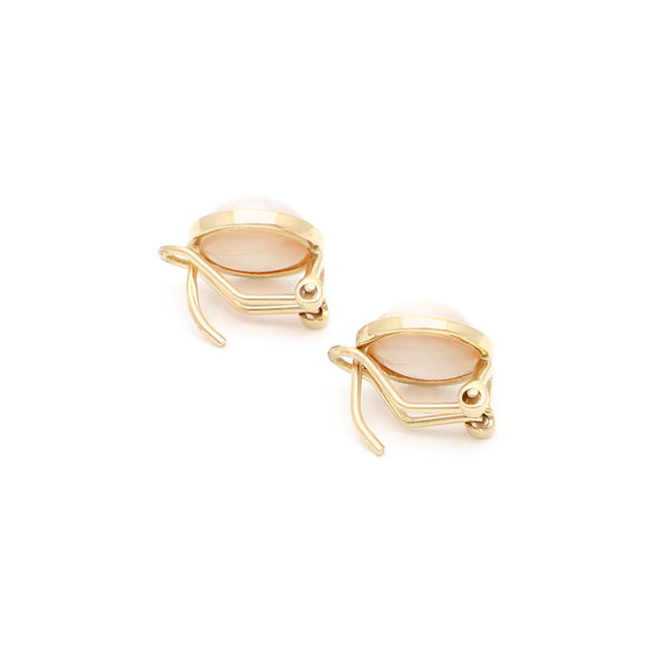 Aretes diseño especial con medias perlas en oro amarillo 14 kilates.