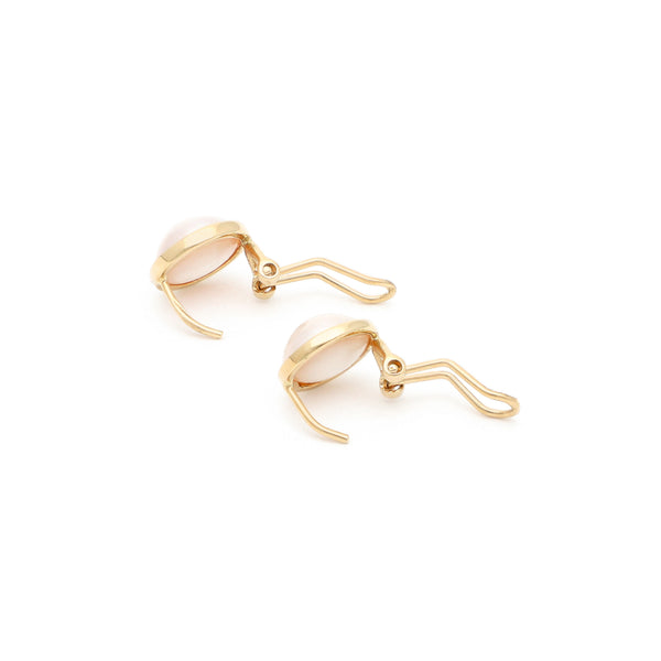 Aretes diseño especial con medias perlas en oro amarillo 14 kilates.