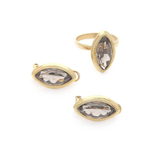 Juego de anillo y aretes torzal con topacio en oro amarillo 14 kilates.