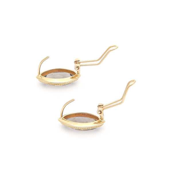 Juego de anillo y aretes torzal con topacio en oro amarillo 14 kilates.