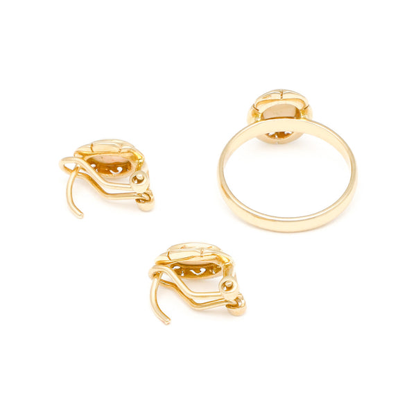 Juego de anillo y aretes diseño especial con ópalos en oro amarillo 14 kilates.