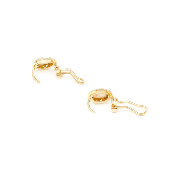 Juego de anillo y aretes diseño especial con ópalos en oro amarillo 14 kilates.