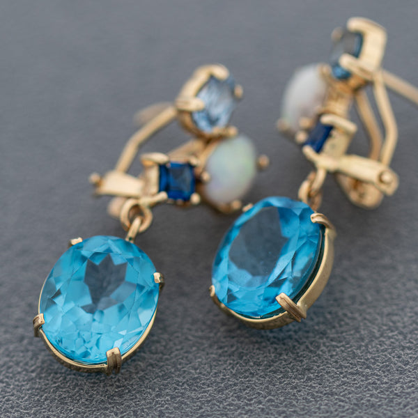 Aretes diseño especial con ópalo y topacios en oro amarillo 14 kilates