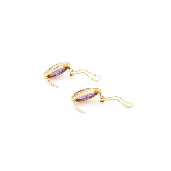 Juego de anillo y aretes diseño especial con alejandrina en oro amarillo 14 kilates.