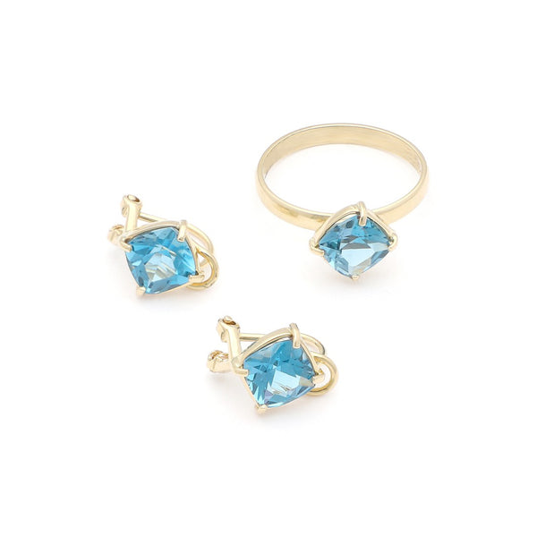 Juego de anillo y aretes con Sky Blue en oro amarillo 14 kilates.
