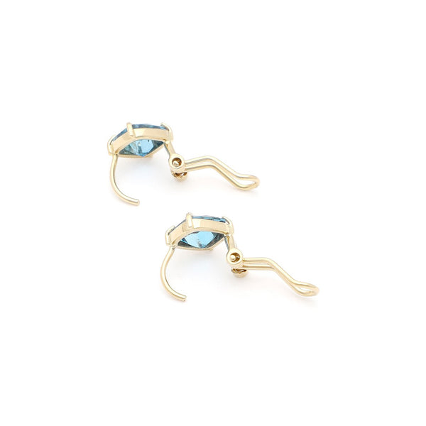 Juego de anillo y aretes con Sky Blue en oro amarillo 14 kilates.