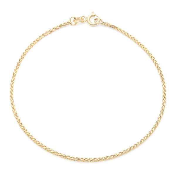 Pulsera eslabón tejido en oro amarillo 14 kilates.