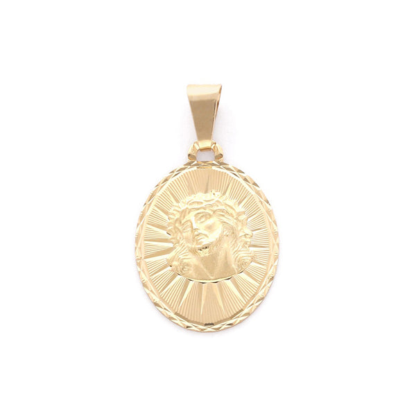 Medalla labrada motivo Divino Rostro en oro amarillo 14 kilates.