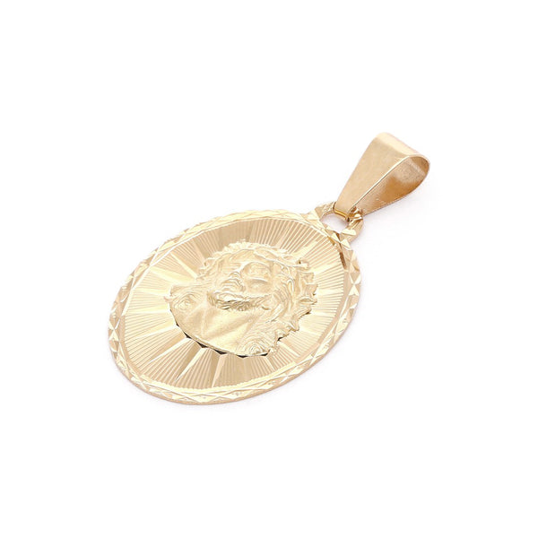 Medalla labrada motivo Divino Rostro en oro amarillo 14 kilates.