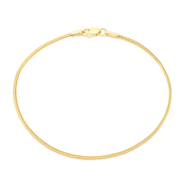Pulsera eslabón tipo espiga en oro amarillo 14 kilates.
