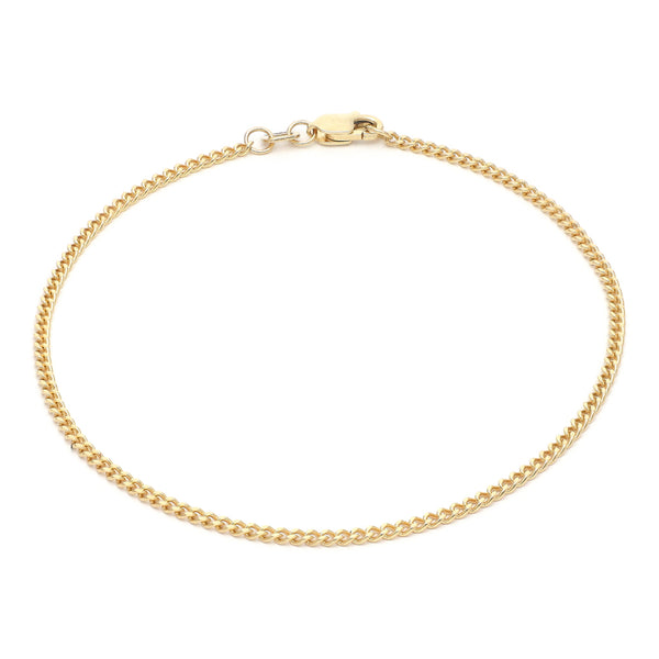 Pulsera eslabón barbado en oro amarillo 14 kilates.
