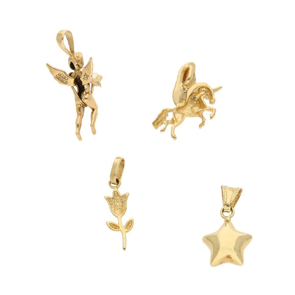 Cuatro dijes diseño especial motivo figuras diversas uno con perla en oro amarillo 14 kilates.