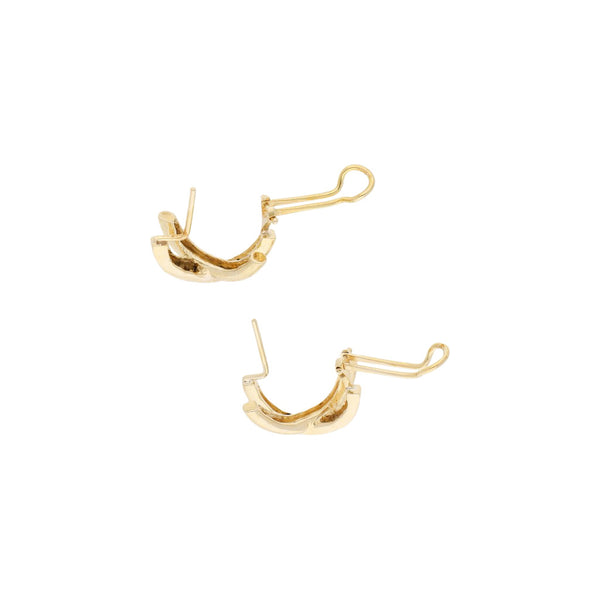 Aretes estilizados con diamantes en oro amarillo 14 kilates.
