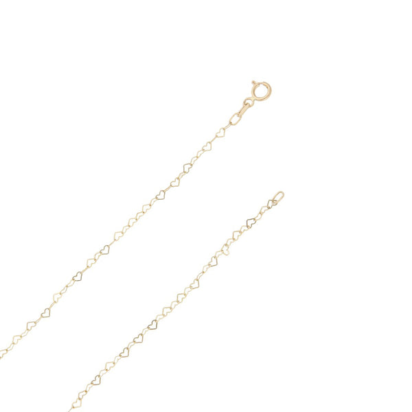 Collar eslabón cruzado motivo corazón y dije hueco motivo niño en oro amarillo 14 kilates.