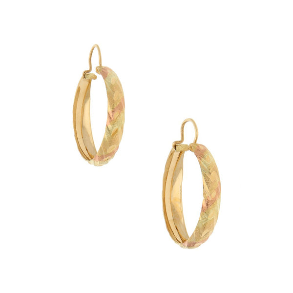 Arracadas labradas en oro amarillo 14 kilates.