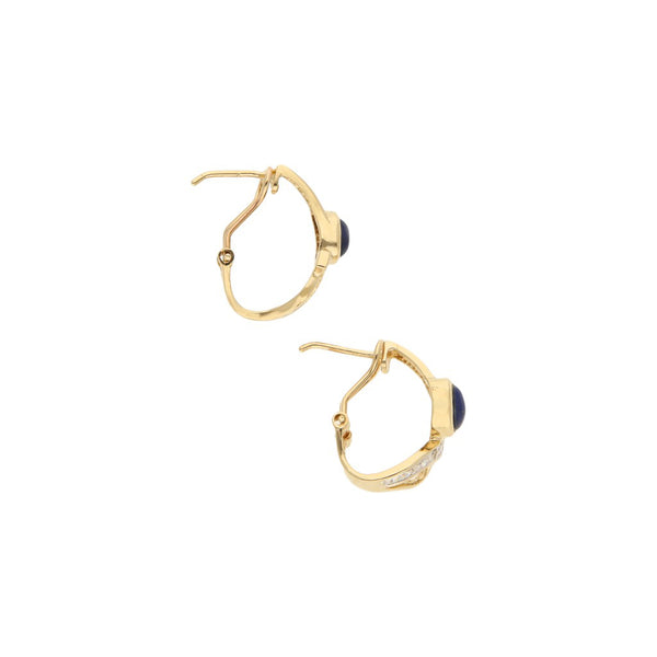 Aretes diseño especial con zafiro estrella y circonias en oro amarillo 14 kilates.