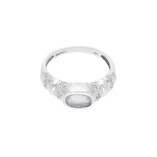 Anillo diseño especial con diamantes y sintéticos en oro blanco 14 kilates.