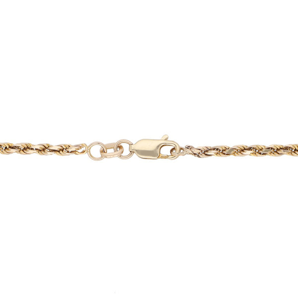 Pulsera eslabón torzal y medalla labrada motivo Cristo en oro amarillo 14 kilates.
