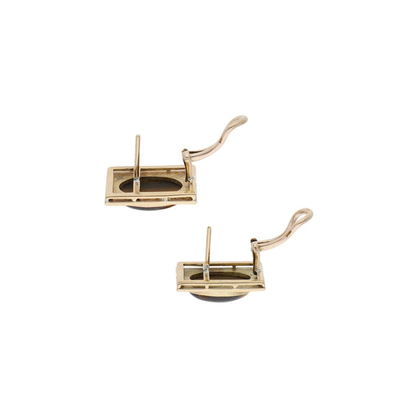 Aretes labrados con ojo de tigre en oro amarillo 14 kilates.
