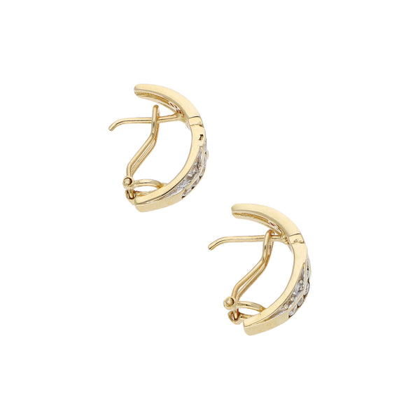 Aretes estilizados con sintéticos en oro amarillo 14 kilates.