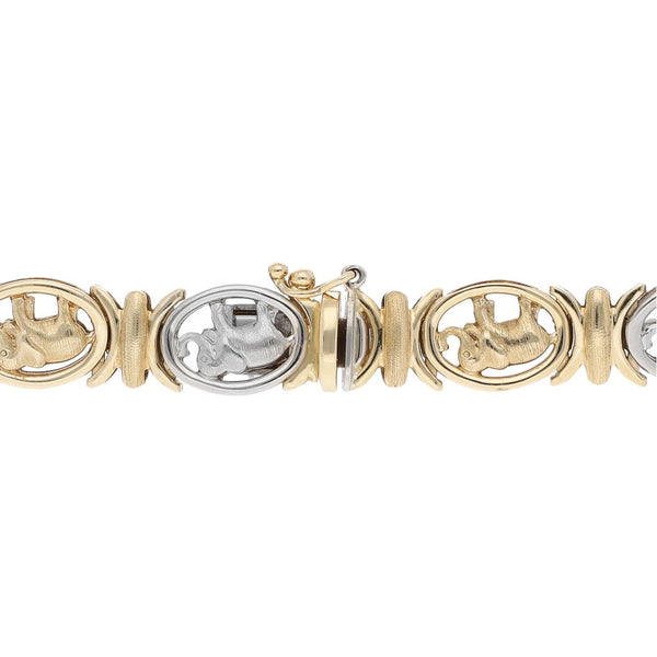 Pulsera eslabón articulado motivo elefante en oro dos tonos 14 kilates.