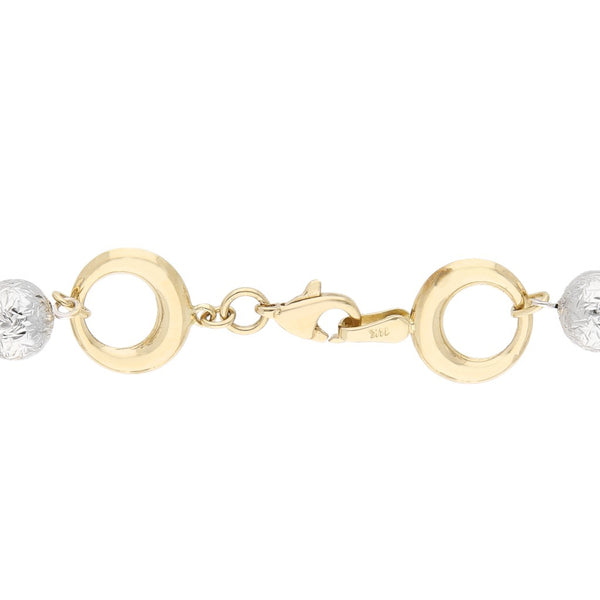 Pulsera eslabón combinado en oro dos tonos 14 kilates.