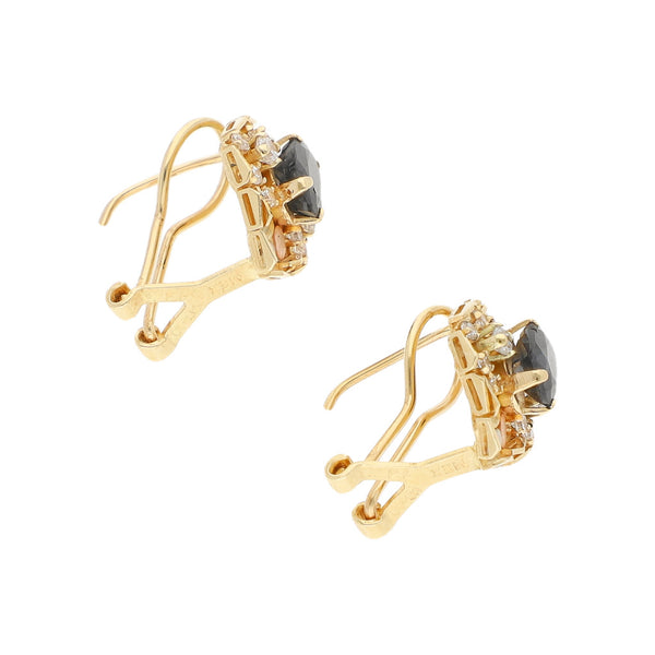 Aretes diseño especial con aplicaciones, zafiros y circonias en oro tres tonos 14 kilates.