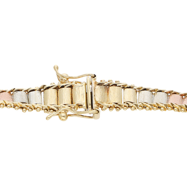 Pulsera eslabón boleado con aplicaciones y tres monedas de dos y medio pesos oro mexicano 21.6 kilates en oro amarillo 14 kilates.