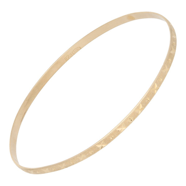 Pulsera de arillo labrada en oro amarillo 14 kilates.