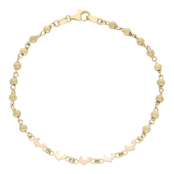 Pulsera eslabón boleado con aplicaciones motivo delfín en oro tres tonos 14 kilates.