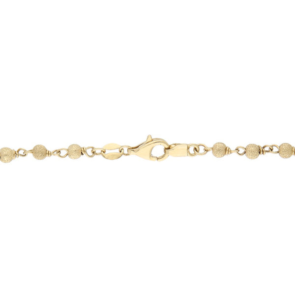 Pulsera eslabón boleado con aplicaciones motivo delfín en oro tres tonos 14 kilates.