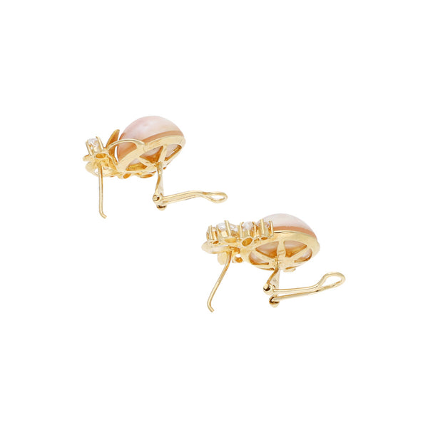 Juego de anillo y aretes diseño especial con media perla y circonias en oro amarillo 14 kilates.