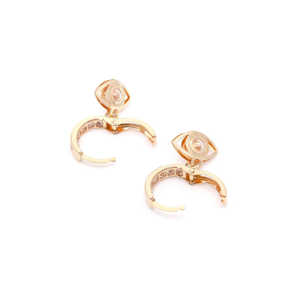 Arracada articulada con sintéticos y colgante motivo ojo en oro amarillo 14 kilates.