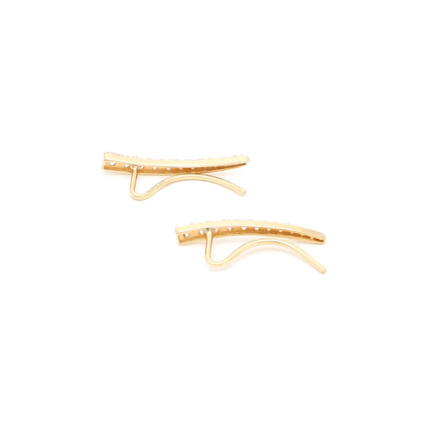 Aretes estilizados con circonias en oro amarillo 14 kilates.