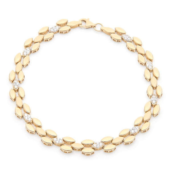 Pulsera eslabón articulado con aplicaciones de circonias en oro amarillo 14 kilates.