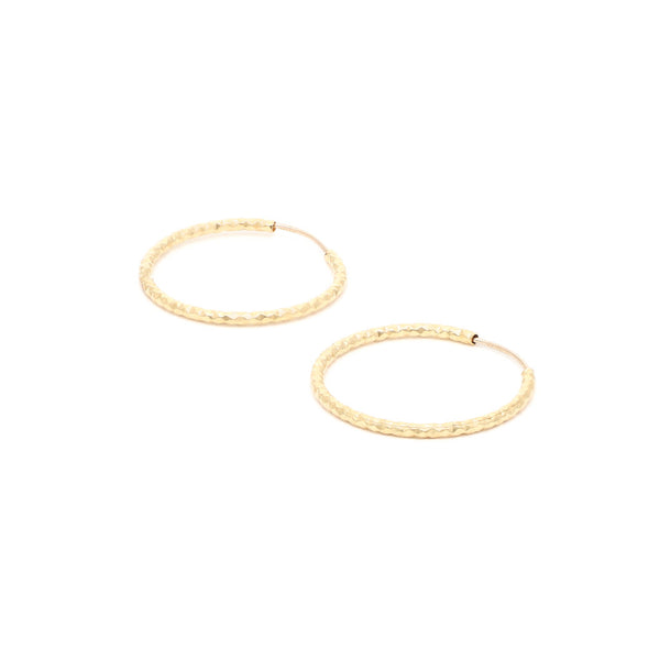 Arracadas facetadas en oro amarillo 14 kilates.