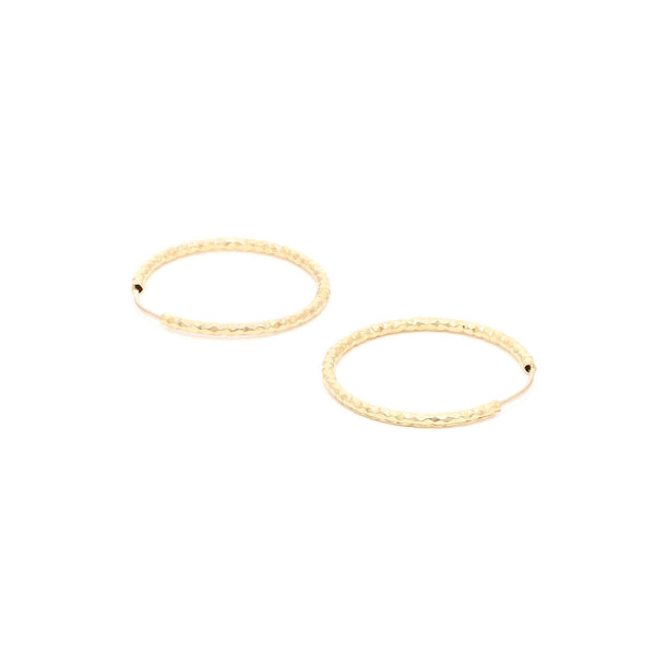 Arracadas facetadas en oro amarillo 14 kilates.