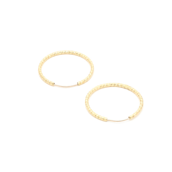 Arracadas facetadas en oro amarillo 14 kilates.