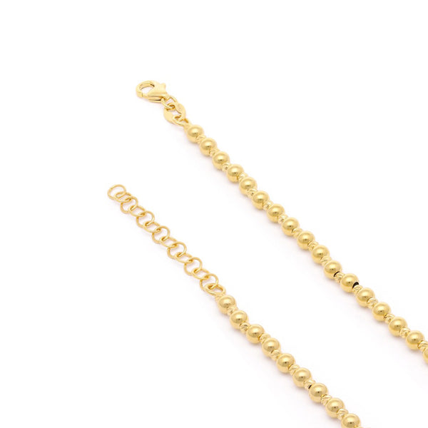 Pulsera eslabón boleado en oro amarillo 14 kilates.