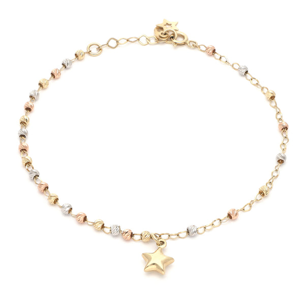 Pulsera eslabón combinado con colgante motivo estrella en oro tres tonos 14 kilates.