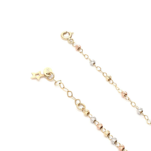 Pulsera eslabón combinado con colgante motivo estrella en oro tres tonos 14 kilates.