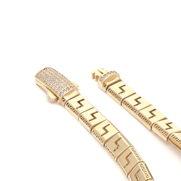 Pulsera eslabón articulado con sintéticos motivo grecas en oro amarillo 14 kilates.