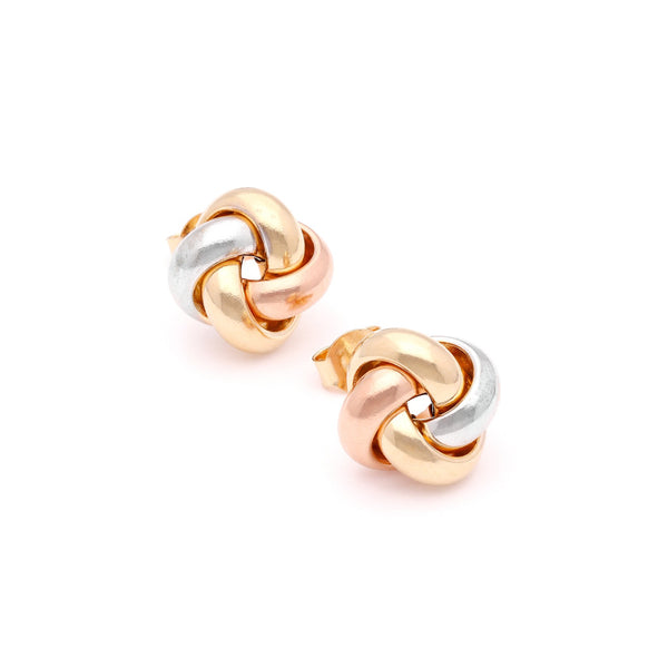 Aretes lisos motivo nudo en oro tres tonos 14 kilates.