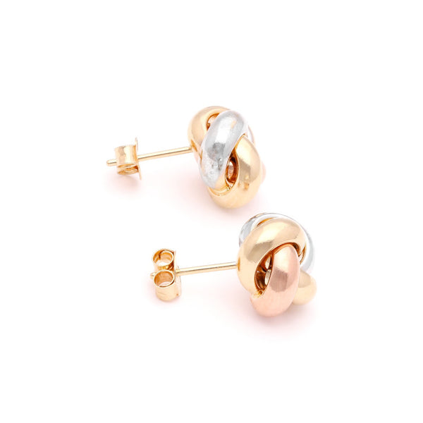 Aretes lisos motivo nudo en oro tres tonos 14 kilates.