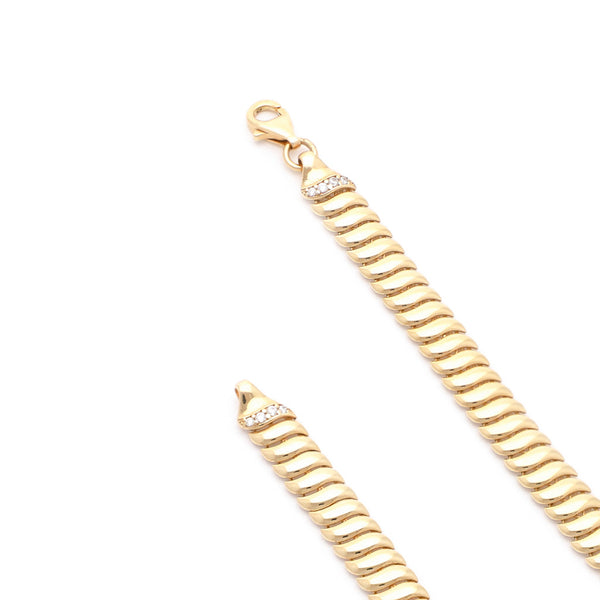 Pulsera eslabón articulado con circonias en oro amarillo 14 kilates.