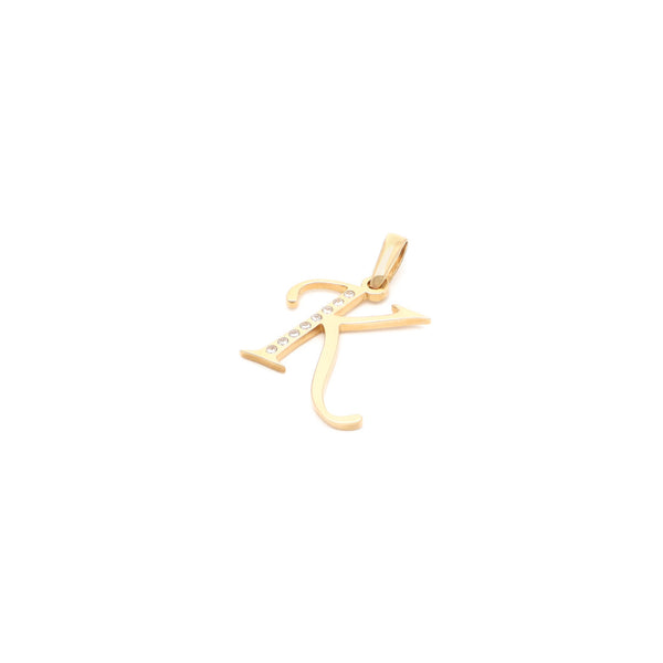 Dije diseño especial motivo letra K con circonias en oro amarillo 14 kilates.