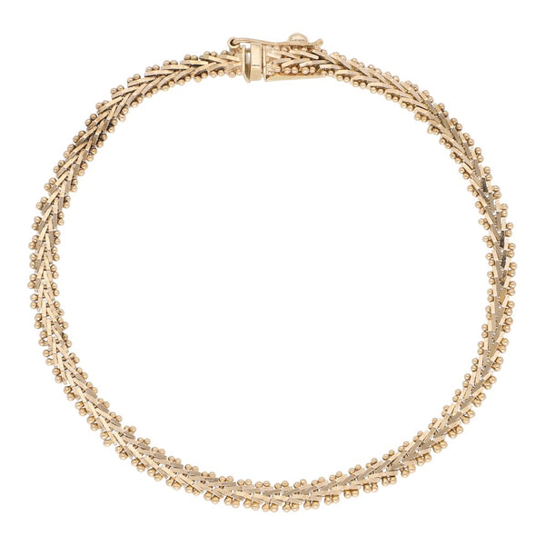 Pulsera eslabón boleado en oro amarillo 14 kilates.