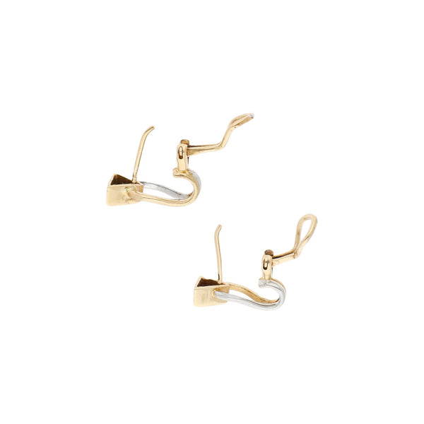 Aretes estilizados en oro dos tonos 14 kilates.