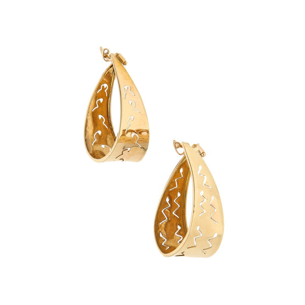 Arracadas estilizadas en oro amarillo 14 kilates.