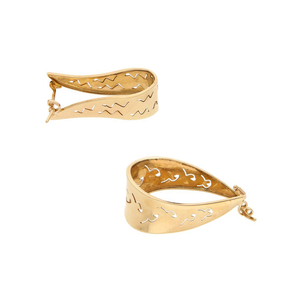 Arracadas estilizadas en oro amarillo 14 kilates.